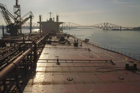 Deck of a large Ship in the with the Forth Rail bridge in the background