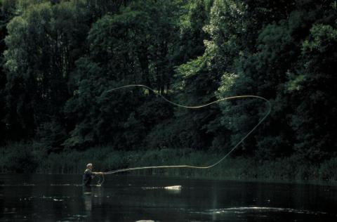A man angling in a river